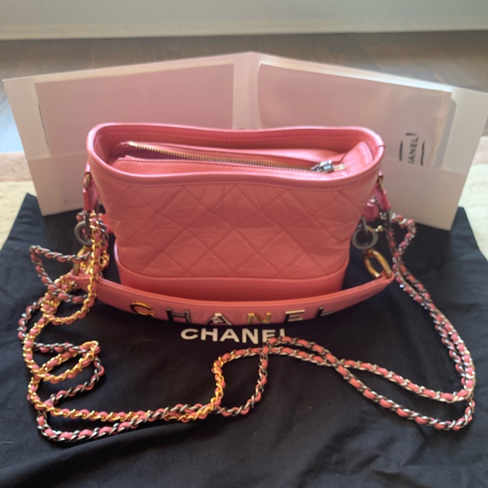 Brand new Chanel Gabriel handbag mini in pink with Chanel logo handle.